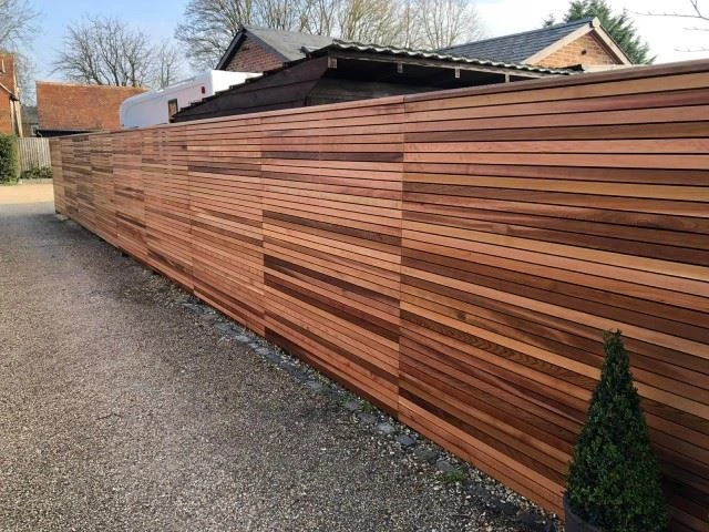 Slatted cedar fencing for driveway and garden